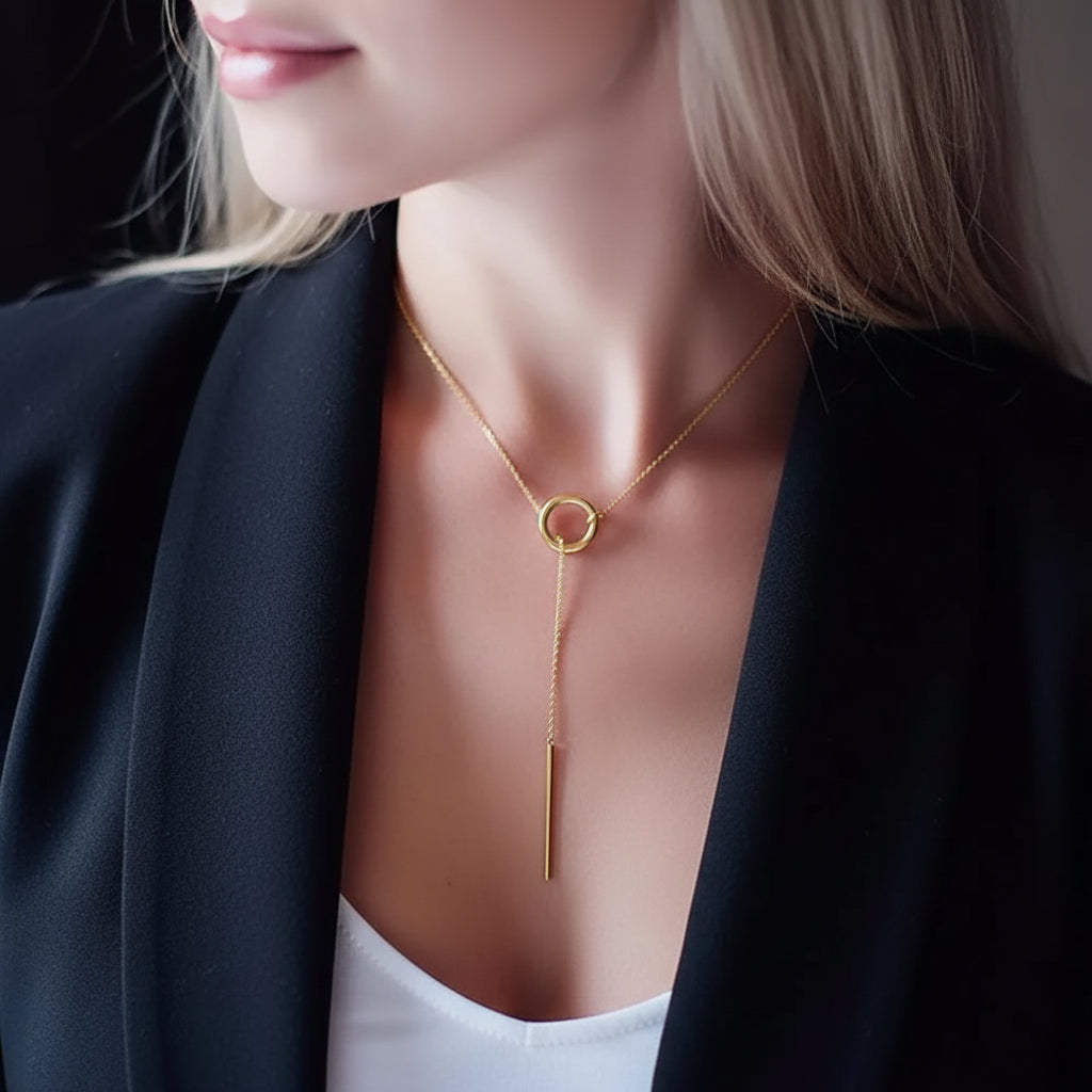 Necklace with a circular pendant worn by a person